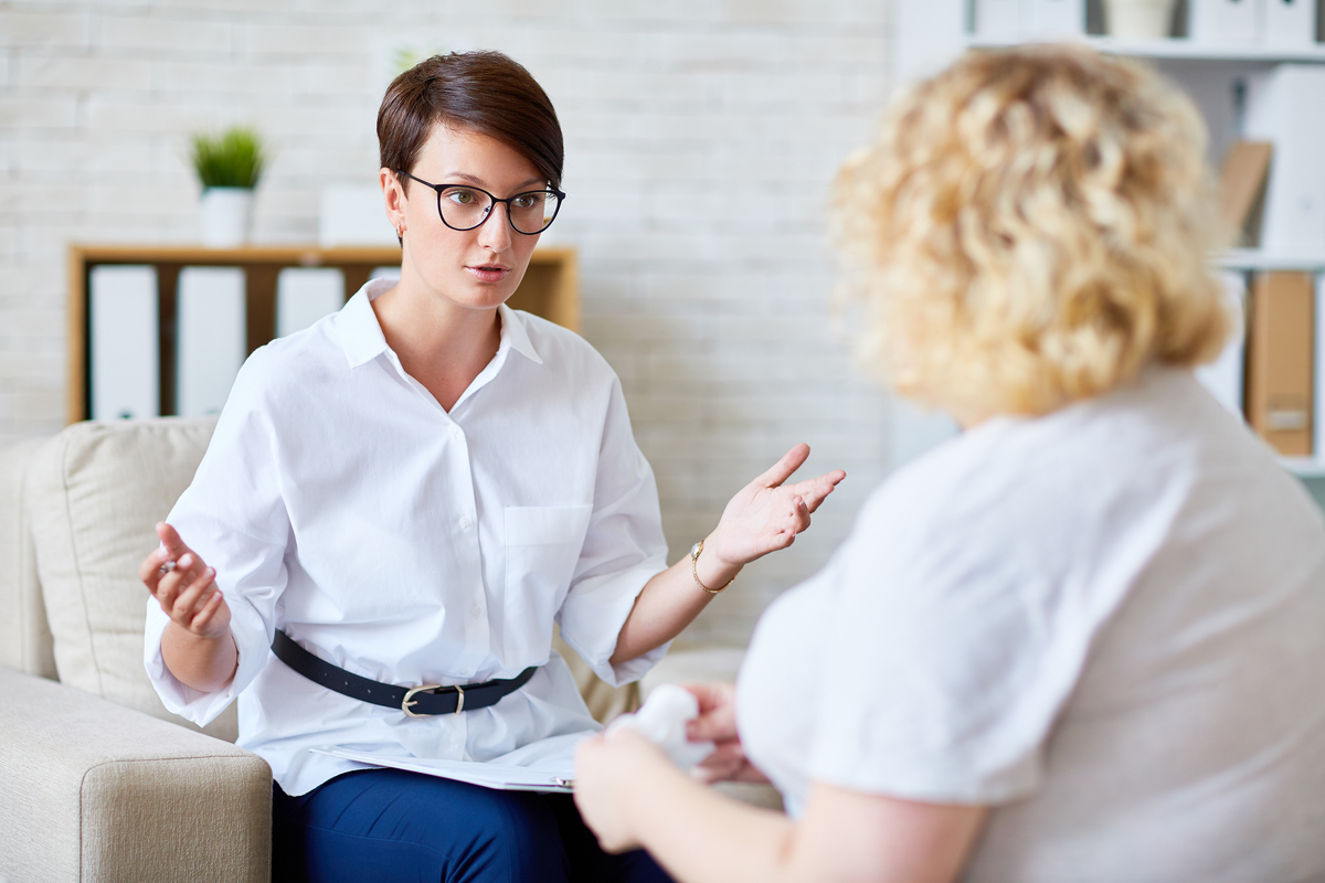 Confident specialist consulting her patient